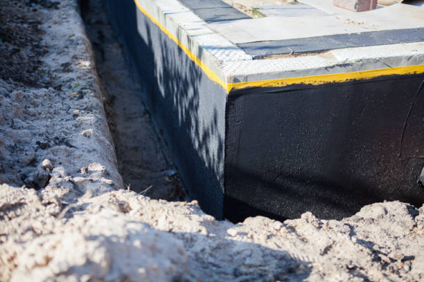 Professional Basement Waterproofing technician working in Georgetown, GA